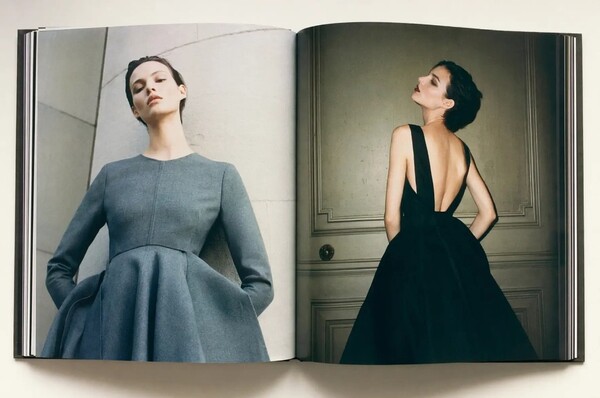 GPT Image 2 example: open coffee-table book with dual fashion editorial portraits in grey and black evening wear